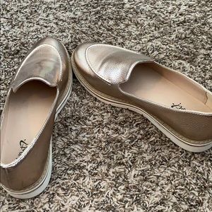 Gold platform loafer style shoes